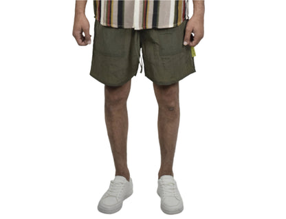 Person wearing a striped shirt and shorts on a white background